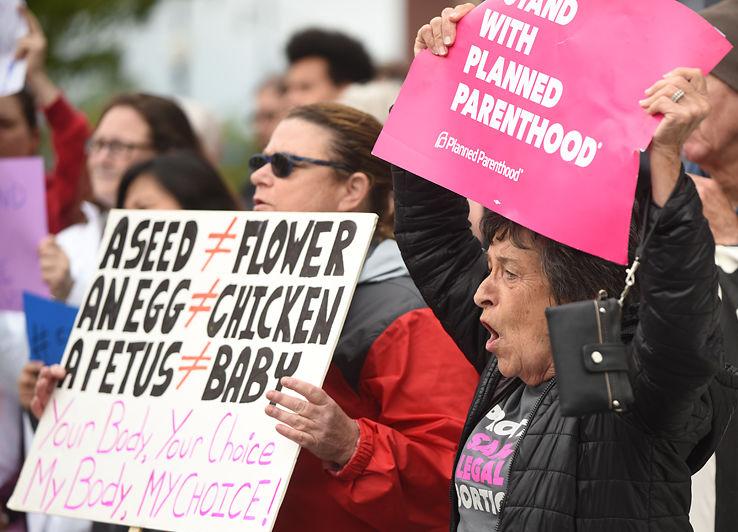 Kay Metcalf chants along with protesters voicing opposition to the abortion law